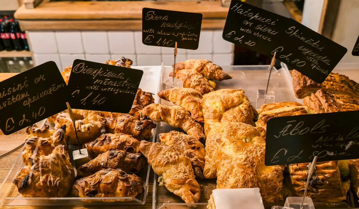 Pastries on a counter with handwritten labels