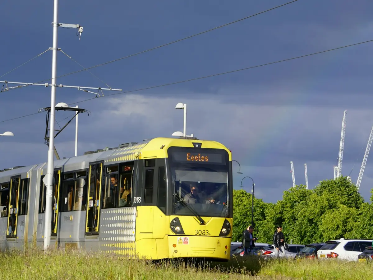 A yellow Metrolink tram