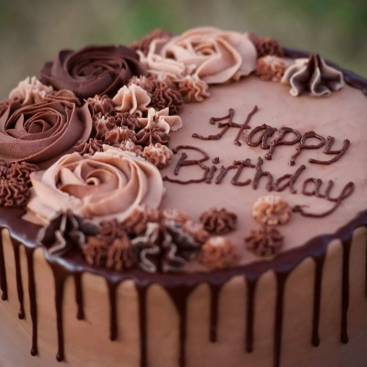 A chocolate birthday cake with piped roses